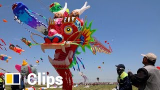 China’s annual kite festival takes off with 280metrelong ‘dragon’ in the sky [upl. by Evyn]