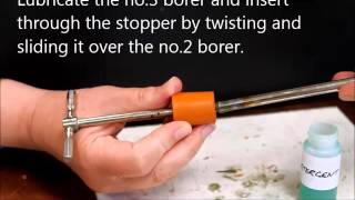 Inserting tubing through a stopper [upl. by Casar]